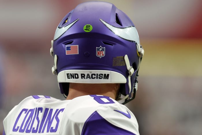 Sep 19, 2021; Glendale, Arizona, USA; An END RACISM sticker is shown on the helmet of Minnesota Vikings quarterback Kirk Cousins (8) prior to the game against the Arizona Cardinals at State Farm Stadium.
